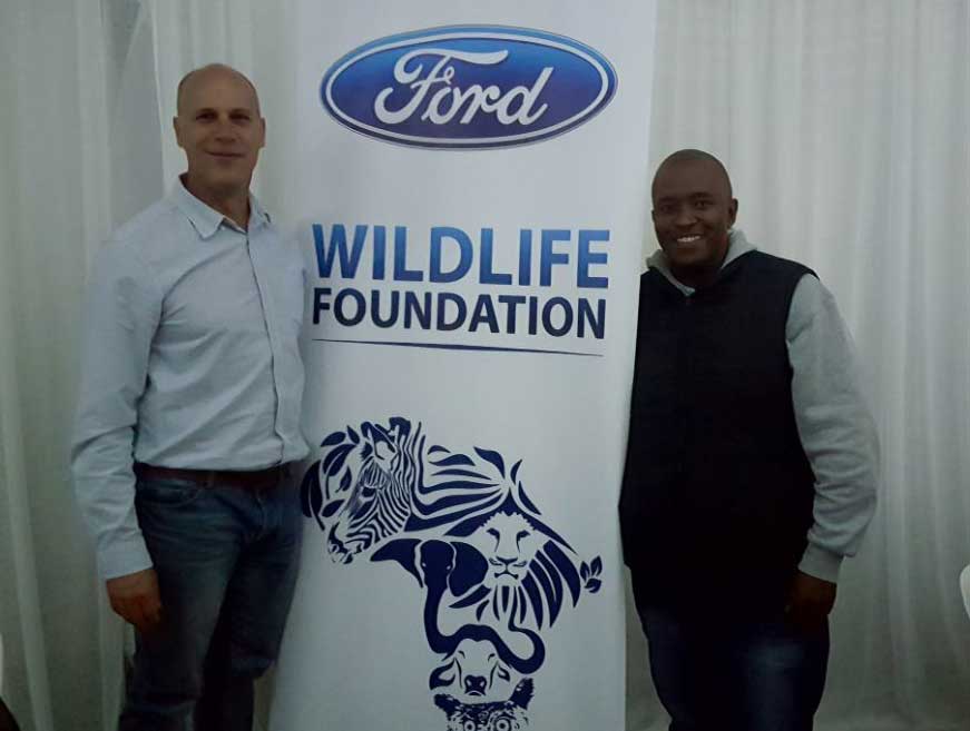 CMH-KEMPSTER-DURBAN-SOUTH-MATTHEW-BUCK-AND-GABRIEL-SITHOLE-STANDING-BY-THE-WILDLIFE-BANNER