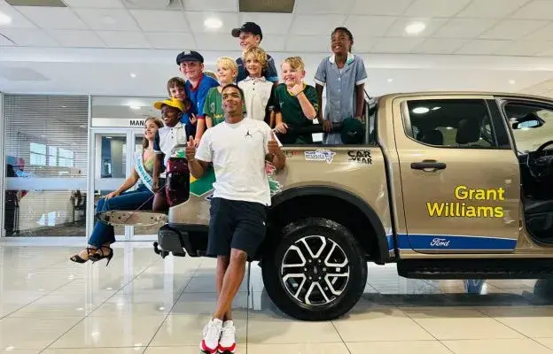 grant-williams-posing-for-a-picture-with-kids